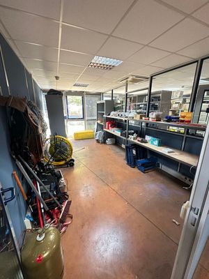 an image of a room with a lot of clutter on the floor
