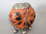 a small metal object with a tiger print design on it