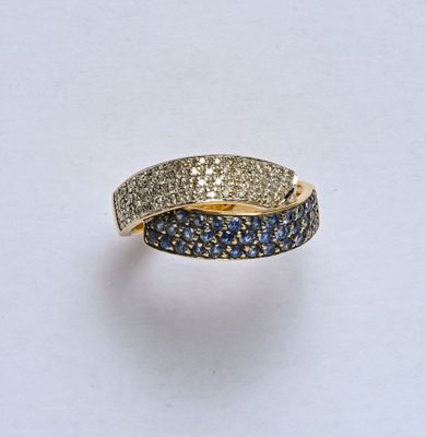 Bague croisée en or jaune 18K (750/oo) lisse ornée d'un pava…