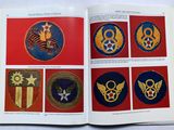a book with a picture of military insignias on it
