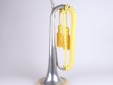 a silver trumpet with a yellow rope on it