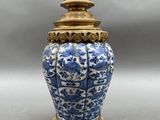 an image of a blue and white vase sitting on top of a table