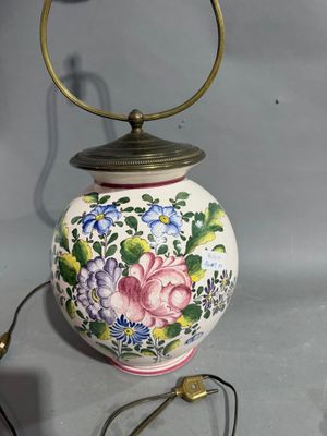 a lamp that is on a table next to a lamp