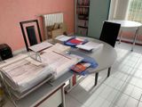 a table with a bunch of papers on it