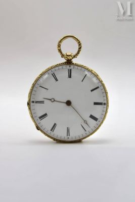 a gold pocket watch with roman numerals on the face