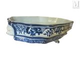 a blue and white bowl with elephants on it