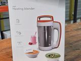 a box that has a blender in it on a table