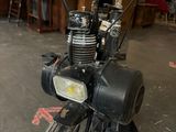 a small motorcycle that is parked in a garage