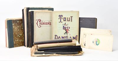 several books are stacked on top of each other on a white surface