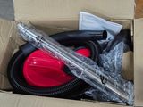 a box with a blow dryer and a hose inside of it