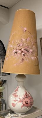 a lamp that is on a table in a room