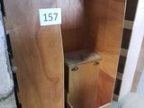 a wooden cabinet with a number on it in a room