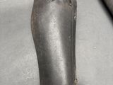 a hand that is holding a pair of boots