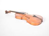 a violin that is sitting on a white surface