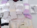 many pairs of socks that are sitting on a table