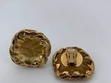 pair of gold tone swarovs with clear crystal stones