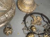 a lot of brass items that are on the table