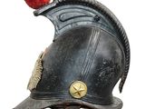 a black helmet with a red pom pom on top of it