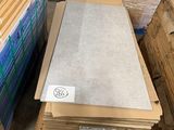 several boxes of cardboard are stacked on top of each other in a warehouse