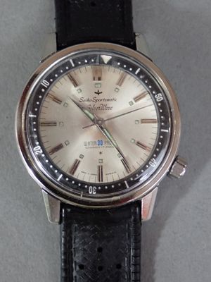 a close up of a watch on a table