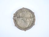 a close up of a coin on a white surface with a white background