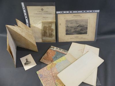 an old photo of a collection of old maps and other items
