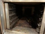 an open oven with a lot of food inside of it