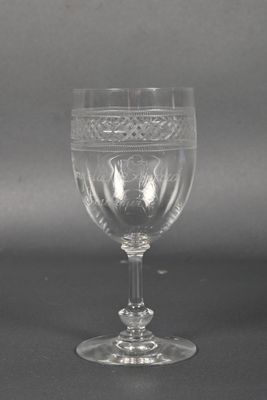a wine glass that is sitting on a table