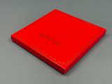 an image of a red box on a table with a white background