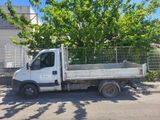 a white truck that is parked on the street