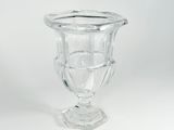 clear glass vase sitting on top of a white surface