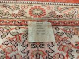 a close up of a rug with a label on it