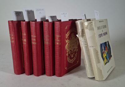 several red books are lined up in a row next to each other