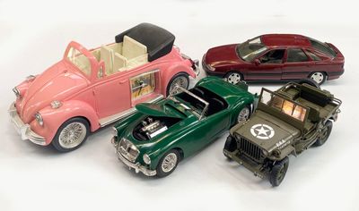 several toy cars are lined up in a row on a white surface