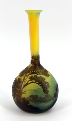 a vase with a painting on it sitting on a white surface
