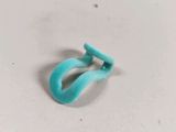 a close up of a small blue object on a white surface