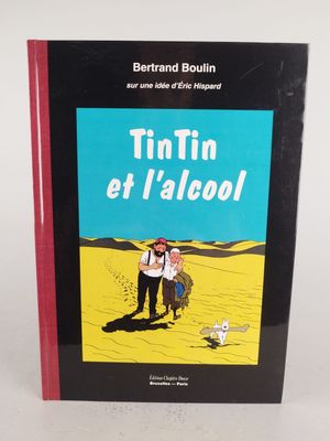 un livre sur lequel figure la photo d'un homme et d'une femme marchant dans le désert