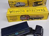 two toy trucks that are sitting next to each other