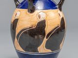 a blue and brown vase with two cats on it