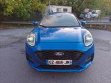 a blue car that is parked in the parking lot