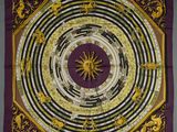 a close up of a square scarf with a circular design on it
