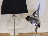 a lamp that is sitting on a table next to a lamp