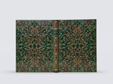 two green and red book covers with intricate designs on them