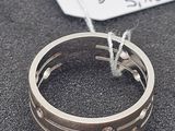 a ring that has been placed on a table with a price tag