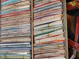 a lot of papers in a box on the floor