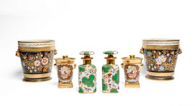 five vases and two containers sitting next to each other
