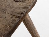 a small wooden table with two wooden legs