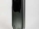 a black vase sitting on a white surface
