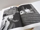an open book with a black and white photo of a man and a woman