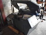 a machine that is sitting on a pallet in a garage